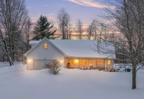 Set on a private, wooded 2.3-acre corner lot just minutes from - Beach Home for sale in Williamsburg, Michigan on Beachhouse.com