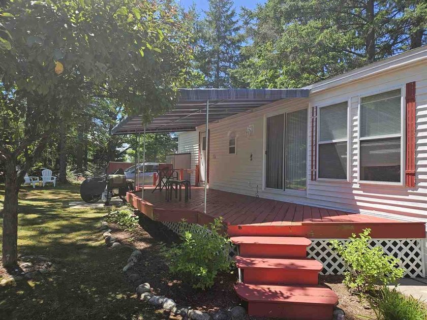 Welcome Home! This Breckenridge Model is located  on a shaded - Beach Home for sale in Alanson, Michigan on Beachhouse.com