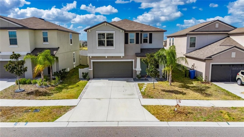 Welcome to this exceptional 2022-built residence offering the - Beach Home for sale in Wimauma, Florida on Beachhouse.com