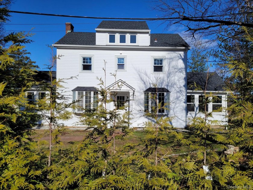 Location, location, location! This charming house is in - Beach Home for sale in Oyster Bay, New York on Beachhouse.com