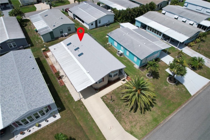 Roof & A/C 2024. Home is just beyond the golf course. Inside - Beach Home for sale in Barefoot Bay, Florida on Beachhouse.com