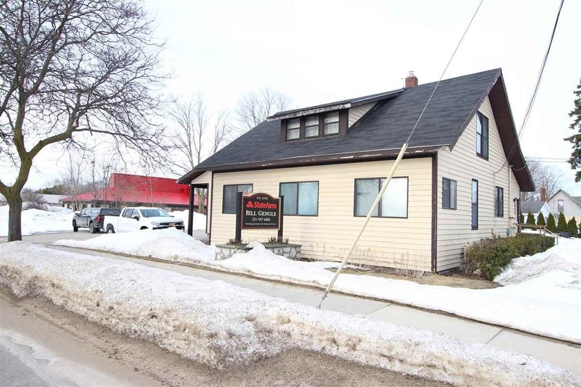 Rare opportunity to own a versatile, mixed-use commercial - Beach Commercial for sale in Charlevoix, Michigan on Beachhouse.com