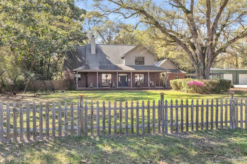 Nestled on a spacious 1 acre lot in Pace, this versatile - Beach Home for sale in Pace, Florida on Beachhouse.com