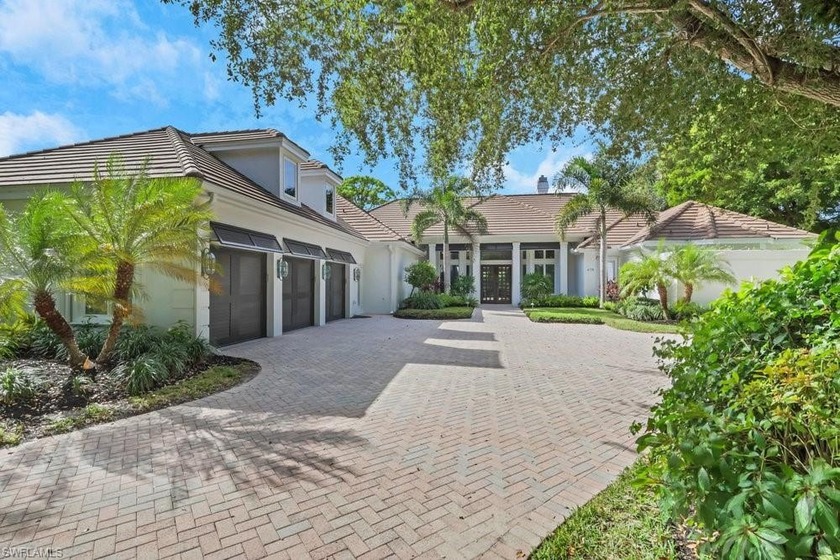 Experience elevated coastal living in this stunning Pelican Bay - Beach Home for sale in Naples, Florida on Beachhouse.com