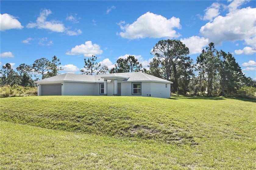 Beautiful Brand-New Home in Lehigh Acres - Move-In Ready!   This - Beach Home for sale in Lehigh Acres, Florida on Beachhouse.com