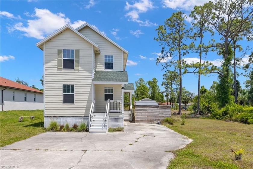This beautiful two-story home offers an excellent location close - Beach Home for sale in Lehigh Acres, Florida on Beachhouse.com
