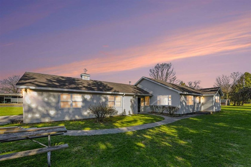 Nestled in a prime location, this charming home sits on an - Beach Home for sale in Charlevoix, Michigan on Beachhouse.com