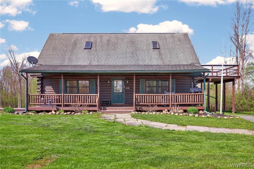 Tucked away on 1.8 acres, this charming log cabin offers the - Beach Home for sale in Derby, New York on Beachhouse.com