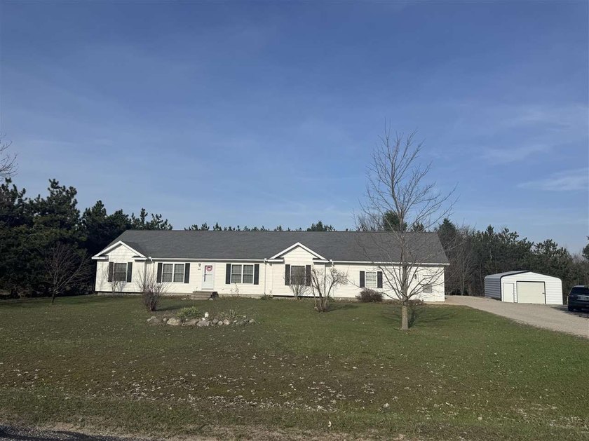 Impeccably maintained 3-bedroom, 2 bath residence offering - Beach Home for sale in Alanson, Michigan on Beachhouse.com