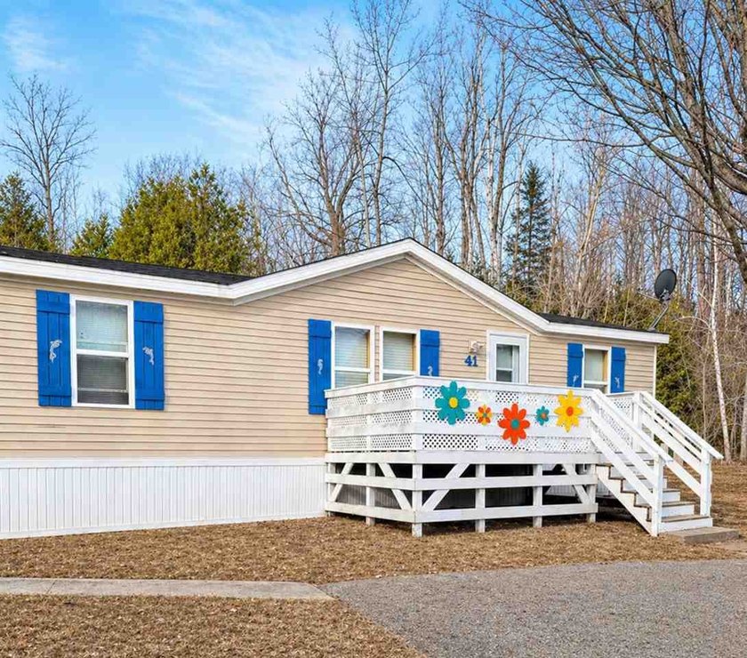Perfectly located halfway between Charlevoix and Petoskey, this - Beach Home for sale in Charlevoix, Michigan on Beachhouse.com