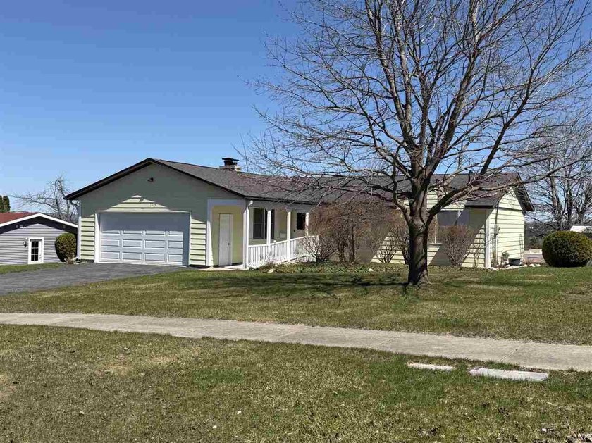 Overlooking downtown Petoskey, this nicely maintained - Beach Home for sale in Petoskey, Michigan on Beachhouse.com