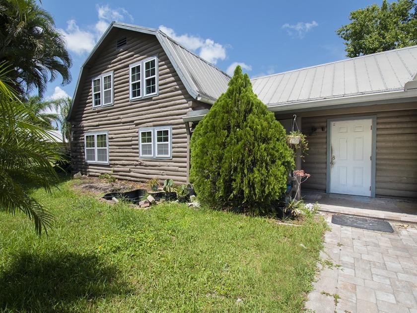 Charming multi-generational log home on a spacious .46-acre lot - Beach Home for sale in Vero Beach, Florida on Beachhouse.com