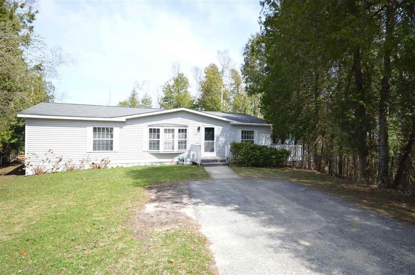 Experience convenient living in this well-maintained 3-bedroom - Beach Home for sale in Charlevoix, Michigan on Beachhouse.com