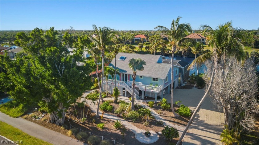 This beach-side oasis embodies tropical charm and Florida living - Beach Home for sale in Sanibel, Florida on Beachhouse.com