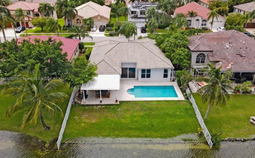 Experience luxurious lakefront living in this fully renovated - Beach Home for sale in Pembroke Pines, Florida on Beachhouse.com