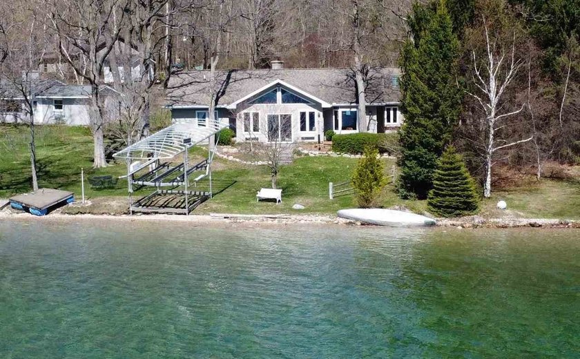 Discover Torch Lake waterfront living in Alden, Michigan with - Beach Home for sale in Alden, Michigan on Beachhouse.com