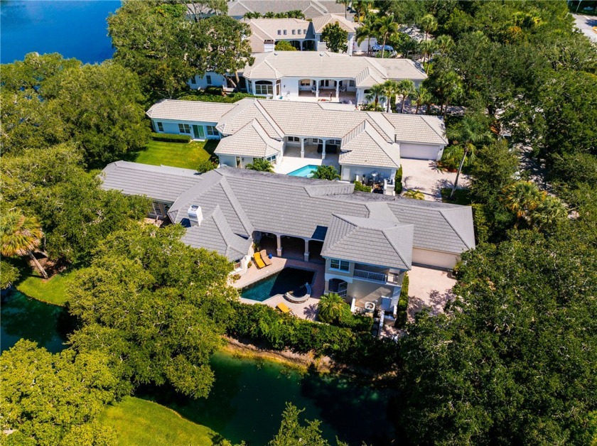 Elegance in Bermuda Bay! This lovely home is privately sited on - Beach Home for sale in Vero Beach, Florida on Beachhouse.com