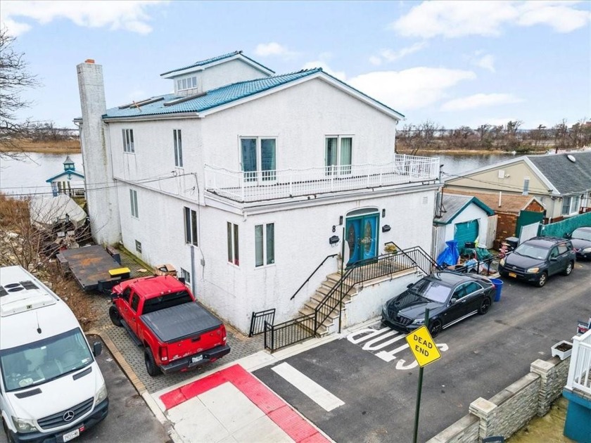 Nestled along the serene waterfront of Gerritsen Beach, this - Beach Home for sale in Brooklyn, New York on Beachhouse.com
