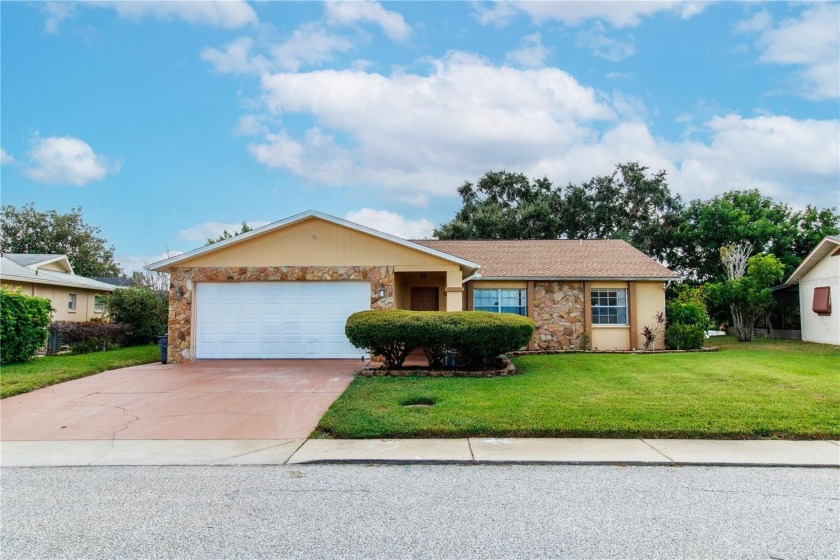 THIS HOME HAS A BEAUTIFUL SETTING OVERLOOKING LAKE CHRISTINA - Beach Home for sale in Port Richey, Florida on Beachhouse.com