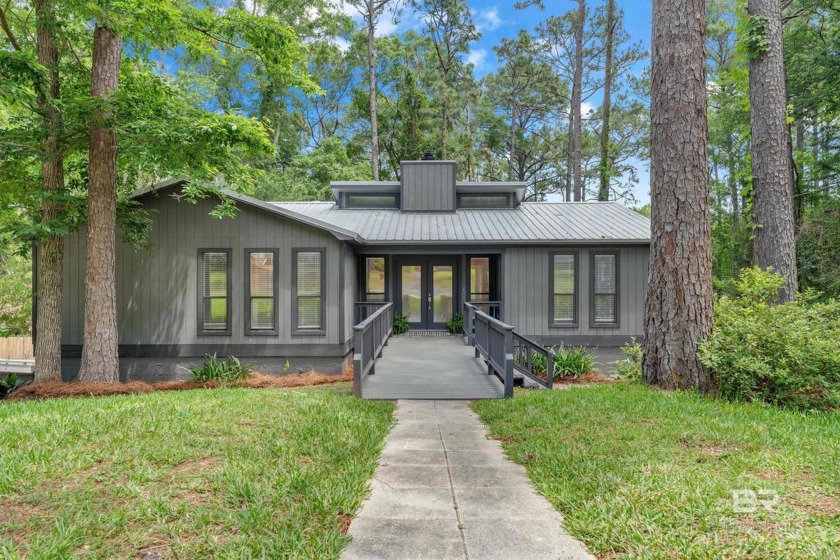 Tucked amongst the mature pines of Lake Forest is this - Beach Home for sale in Daphne, Alabama on Beachhouse.com