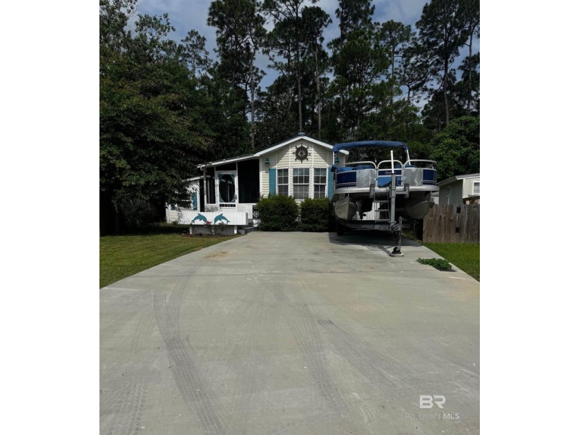 Charming Coastal Cottage with Sunroom  Private Wooded Backyard - Beach Home for sale in Lillian, Alabama on Beachhouse.com