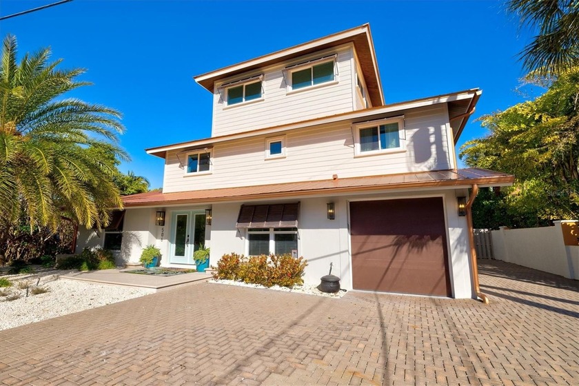 Nestled along a serene canal and embraced by a curtain of mature - Beach Home for sale in Holmes Beach, Florida on Beachhouse.com