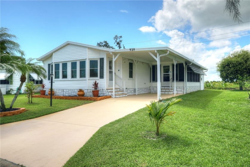 Oh, so pretty! Newer model boasts of over 1400 sq ft inside and - Beach Home for sale in Barefoot Bay, Florida on Beachhouse.com