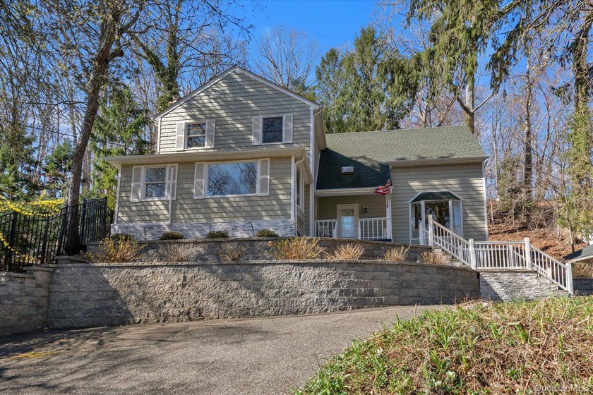 Nestled on a private and picturesque .88-acre property, this - Beach Home for sale in Northport, New York on Beachhouse.com