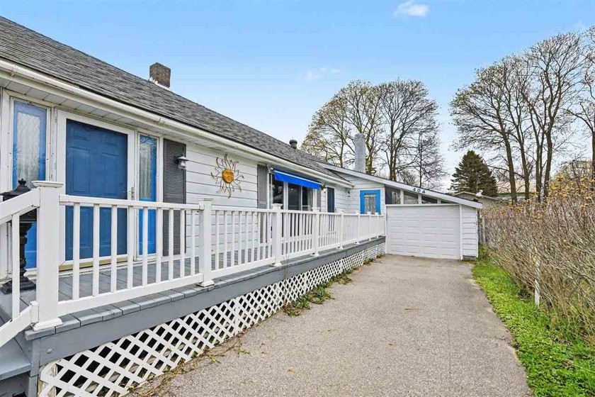 Including the next door lot and Nestled in the heart of - Beach Home for sale in Charlevoix, Michigan on Beachhouse.com