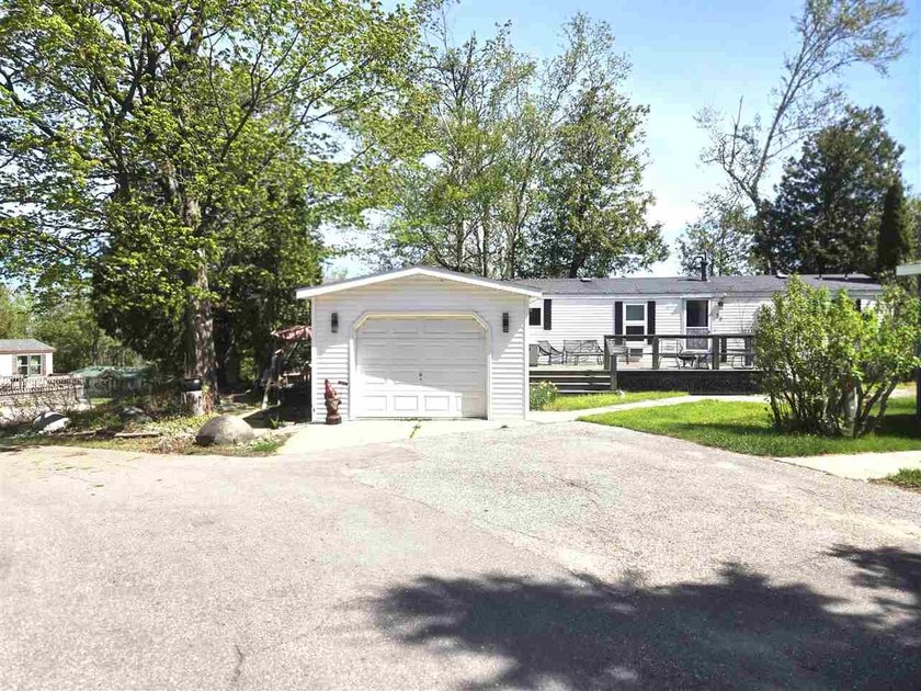 Nestled between Charlevoix and Petoskey, this beautifully - Beach Home for sale in Charlevoix, Michigan on Beachhouse.com