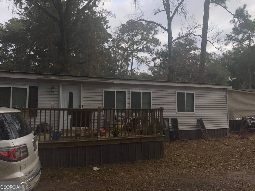 Welcome to 32 Woods Drive, a charming retreat nestled in the - Beach Home for sale in Midway, Georgia on Beachhouse.com