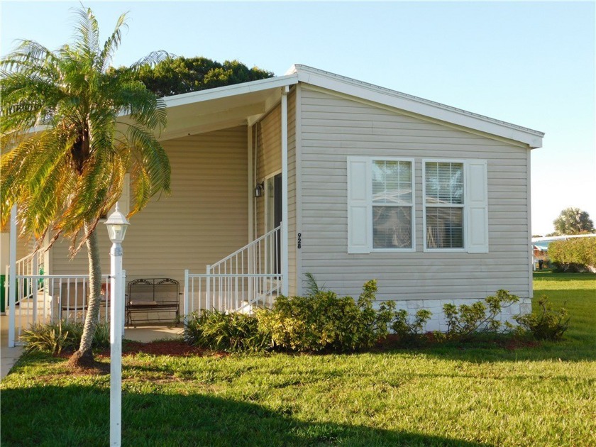 This 2005 Cavalier home is situated on a spacious lot on a - Beach Home for sale in Barefoot Bay, Florida on Beachhouse.com