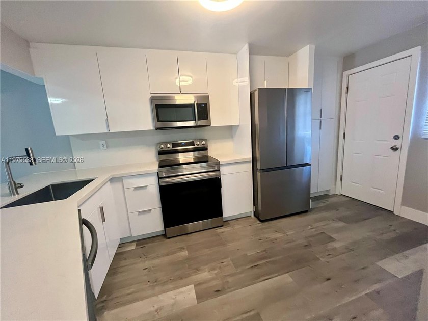 Move-in ready condo featuring a modern kitchen and brand-new - Beach Condo for sale in Miami, Florida on Beachhouse.com