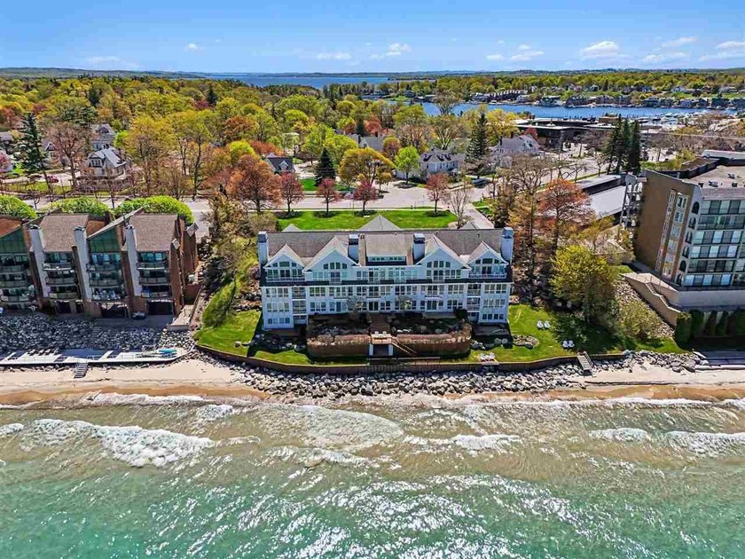 Stunning views of Lake Michigan greet you as you enter this - Beach Condo for sale in Charlevoix, Michigan on Beachhouse.com