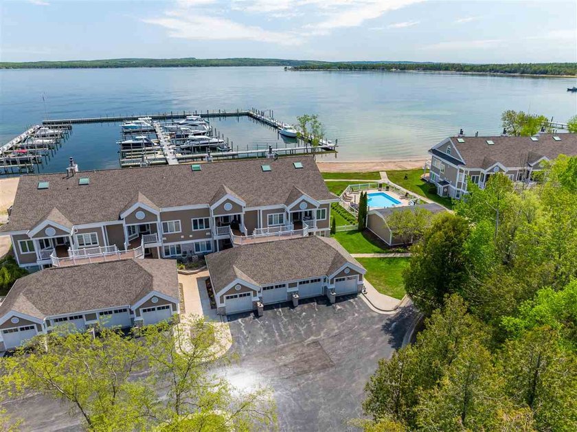 Discover the quintessential Northern Michigan lifestyle in this - Beach Condo for sale in Charlevoix, Michigan on Beachhouse.com