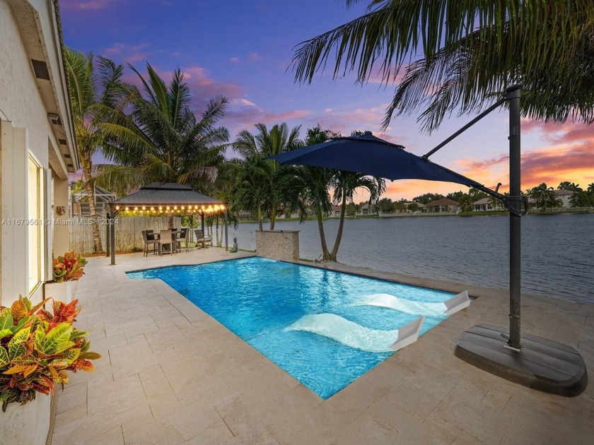 Welcome to your dream home in the exclusive gated community of - Beach Home for sale in Pembroke Pines, Florida on Beachhouse.com