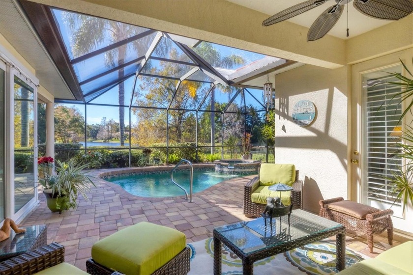 A captivating lake view with mature trees draws you in the - Beach Home for sale in Lakewood Ranch, Florida on Beachhouse.com