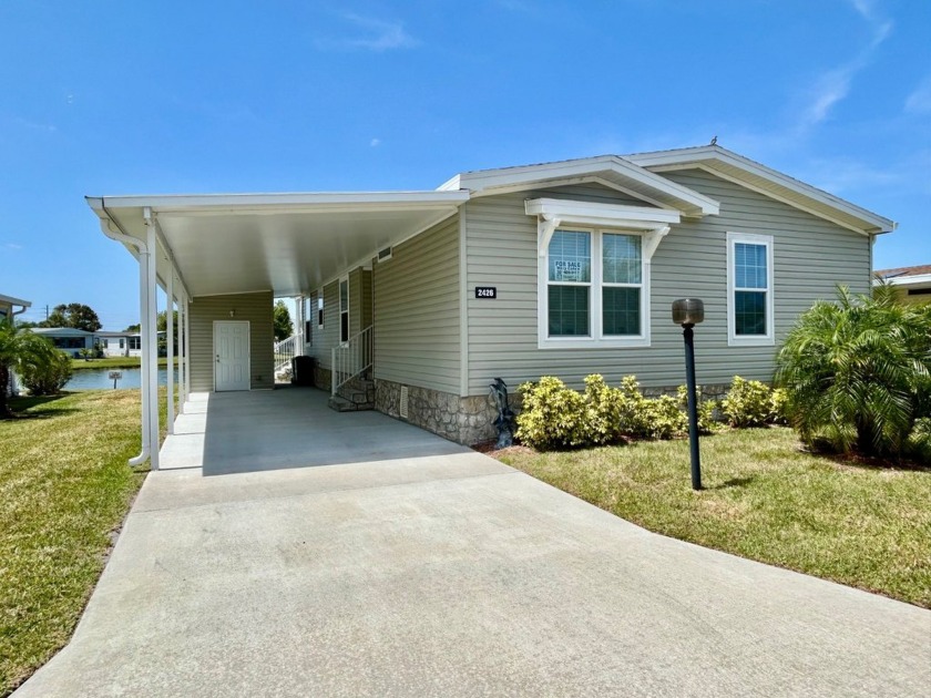 Absolutely stunning lake views set the tone for this beautifully - Beach Home for sale in Melbourne, Florida on Beachhouse.com