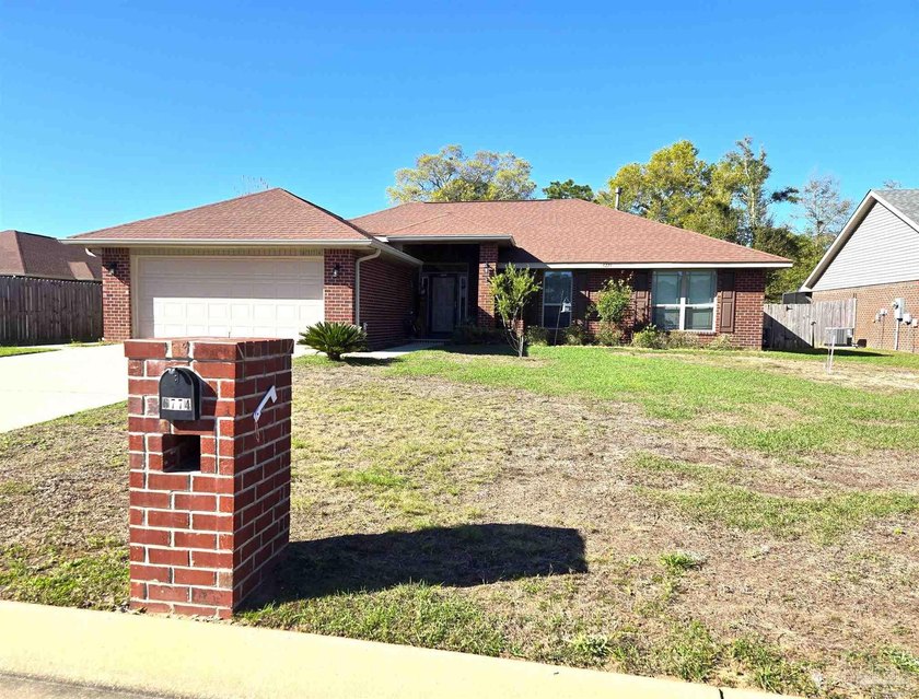 This move-in-ready all brick home is in desirable Ventura - Beach Home for sale in Bagdad, Florida on Beachhouse.com