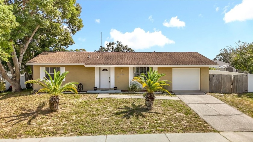 Discover this beautiful 2-bedroom, 1.5-bathroom home featuring - Beach Home for sale in Spring Hill, Florida on Beachhouse.com
