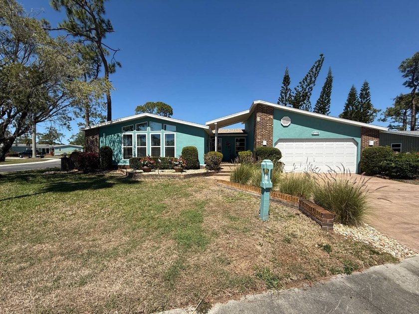 This well-cared for Palm Harbor stucco home is being sold - Beach Home for sale in North Fort Myers, Florida on Beachhouse.com