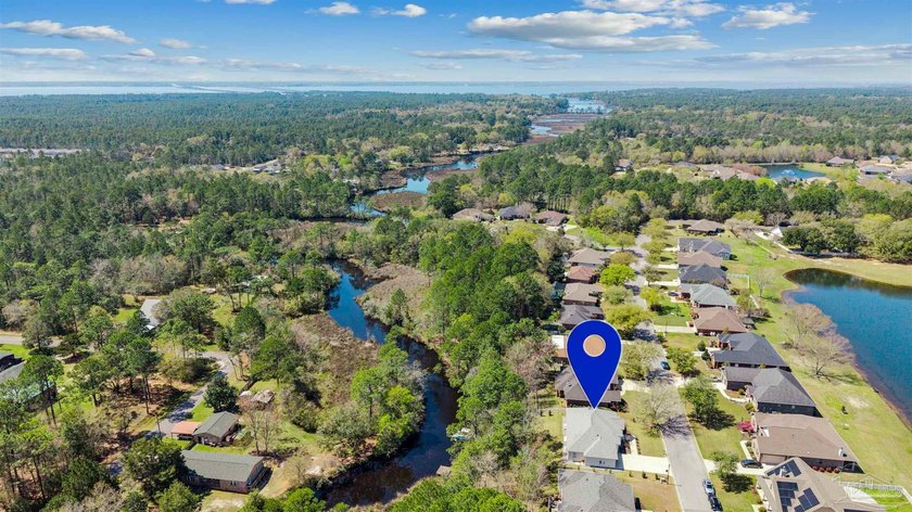Experience peaceful waterfront living in this custom-built home - Beach Home for sale in Milton, Florida on Beachhouse.com