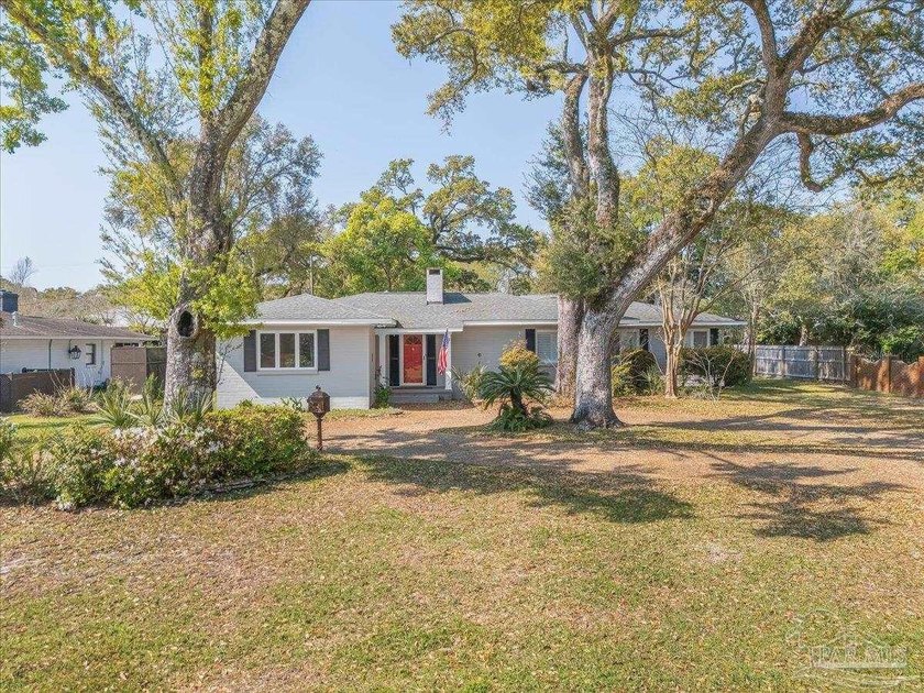 This elegant 4-bedroom, 3-bath residence offering 2,519 square - Beach Home for sale in Pensacola, Florida on Beachhouse.com