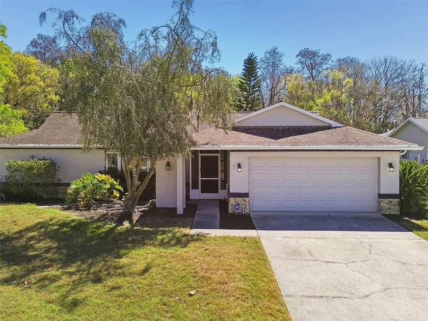 Drive down the winding, tree-lined streets of Fairway Springs to - Beach Home for sale in New Port Richey, Florida on Beachhouse.com