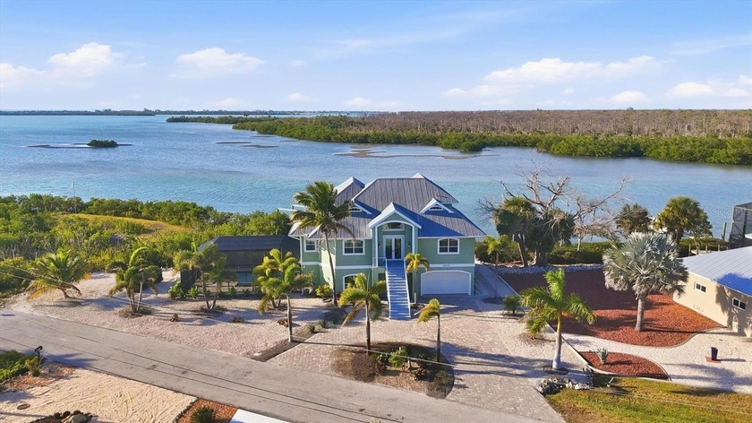 Experience breathtaking sunsets from every level of this - Beach Home for sale in Englewood, Florida on Beachhouse.com