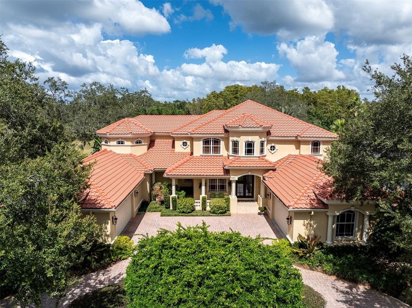 Welcome to this exquisite custom-built estate home perfectly - Beach Home for sale in Tarpon Springs, Florida on Beachhouse.com