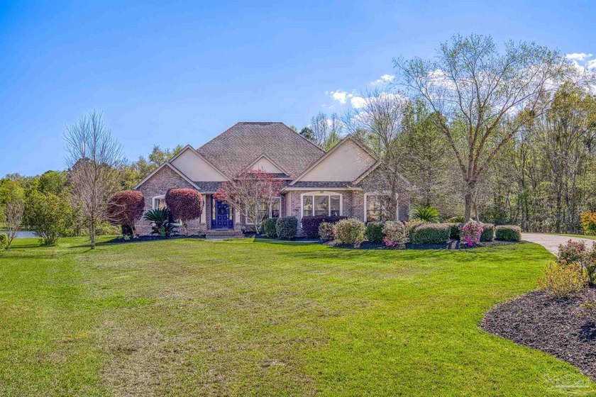 Welcome home to your lake front home in a gated community. This - Beach Home for sale in Milton, Florida on Beachhouse.com