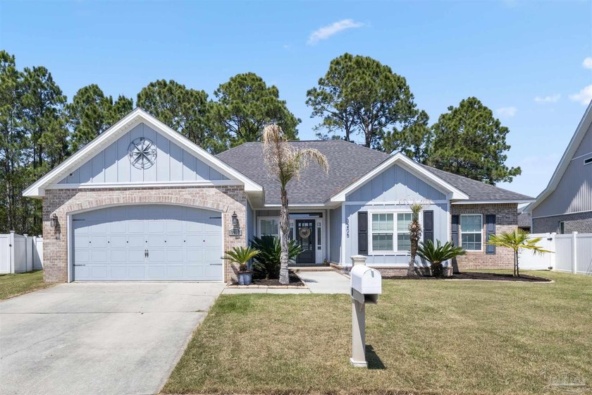 Tucked inside the sought after gated waterfront community of - Beach Home for sale in Pensacola, Florida on Beachhouse.com