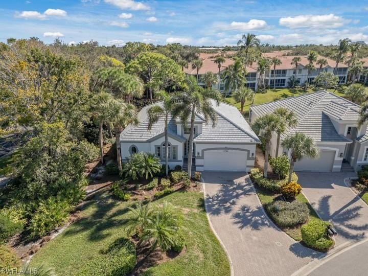 Set on a desirable corner lot with serene water and lush - Beach Home for sale in Bonita Springs, Florida on Beachhouse.com