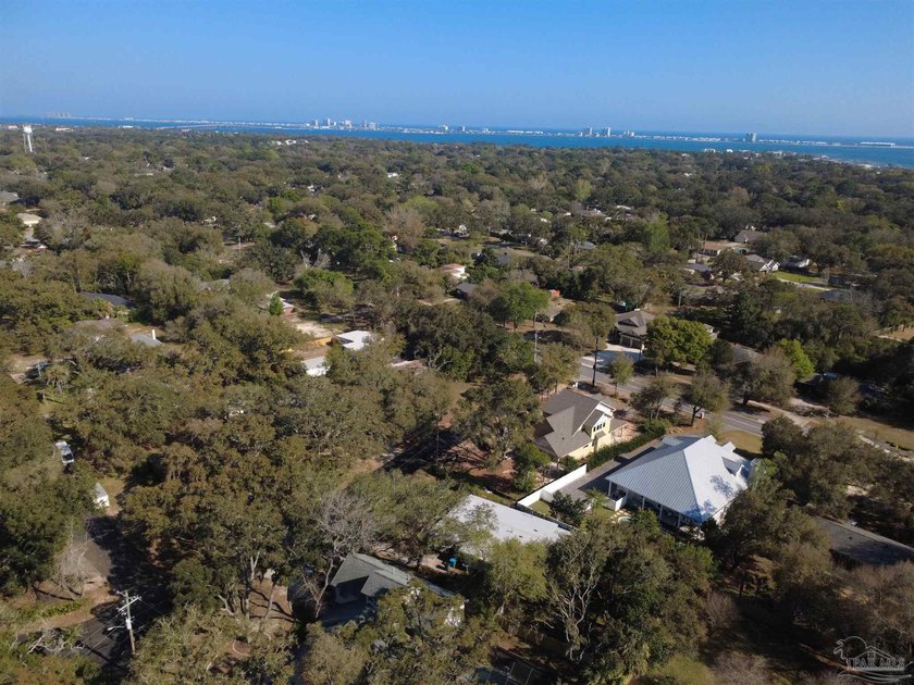Nestled on a spacious 0.28-acre lot, this home offers a rare - Beach Home for sale in Gulf Breeze, Florida on Beachhouse.com